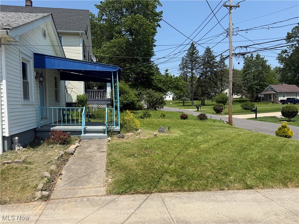 6350 Meadowbrook Road Garfield Heights, OH 44125 - Photo 6 of 28 View of green lawn featuring a porch