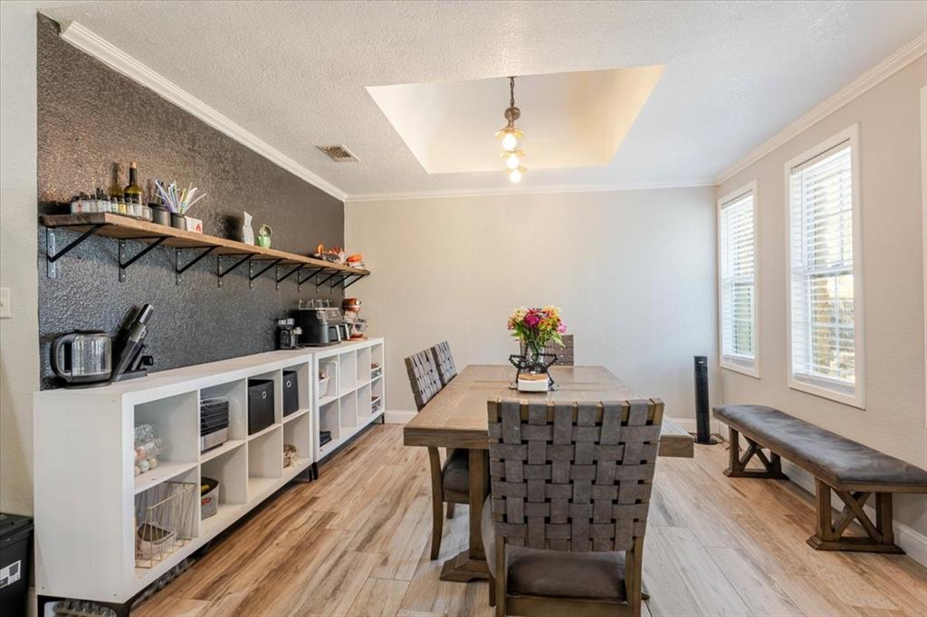 2350 Grindstone Road Millsap, TX 76066 - Photo 11 of 33 a view of a dining room with furniture window and wooden floor