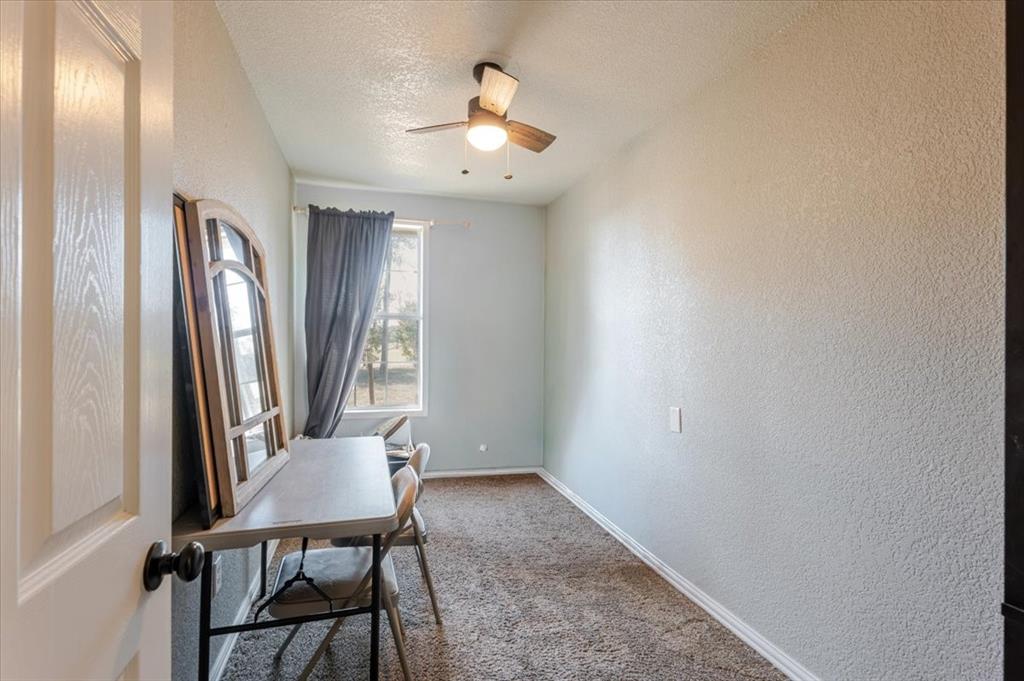 2350 Grindstone Road Millsap, TX 76066 - Photo 14 of 33 a view of a hallway with furniture and a window