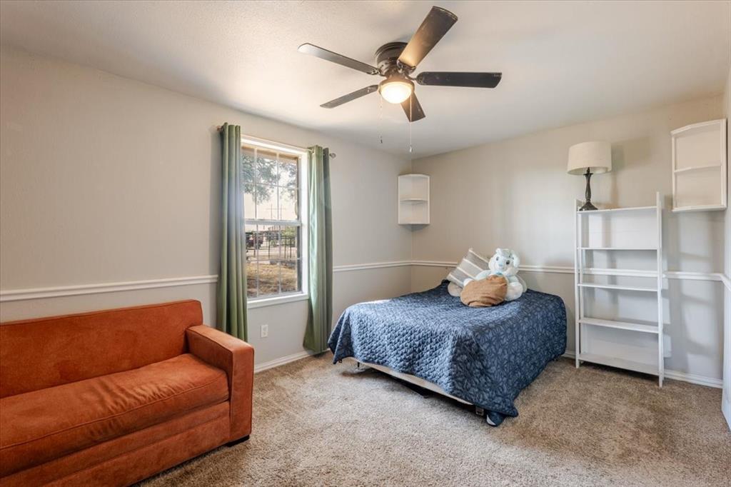 2350 Grindstone Road Millsap, TX 76066 - Photo 19 of 33 a living room with furniture and a window