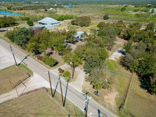 a view of a lake with a yard