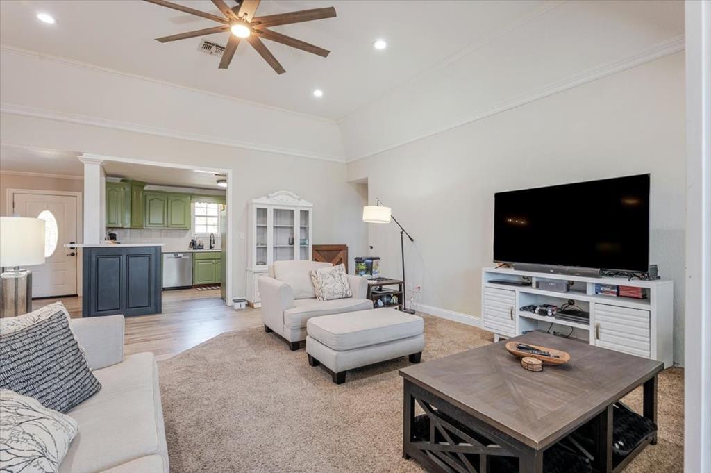 2350 Grindstone Road Millsap, TX 76066 - Photo 9 of 33 a living room with furniture and a flat screen tv