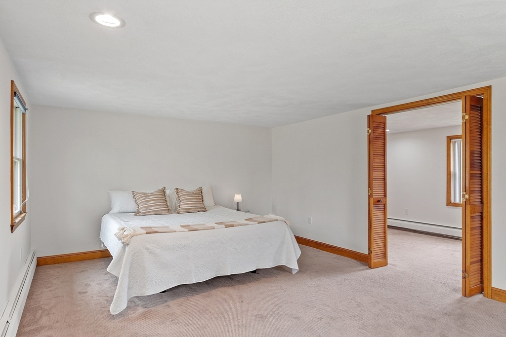 40 Elizabeth Road Billerica, MA 01821 - Photo 23 of 42 a bedroom with a bed and a cabinets
