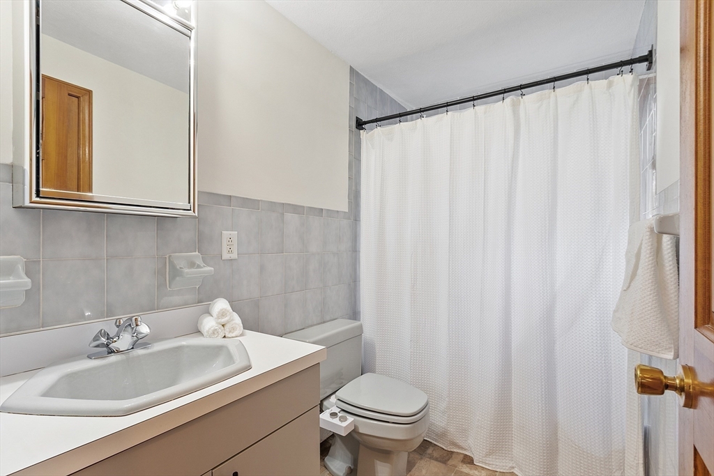 40 Elizabeth Road Billerica, MA 01821 - Photo 30 of 42 a bathroom with a sink toilet and mirror