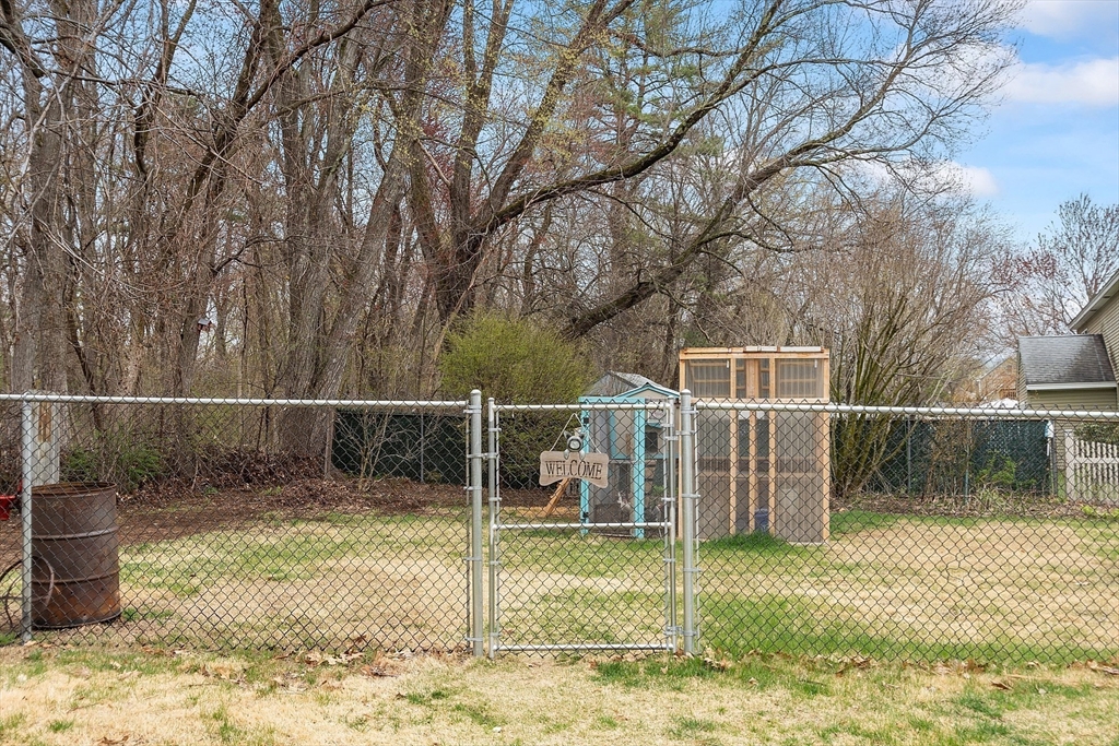 40 Elizabeth Road Billerica, MA 01821 - Photo 34 of 42 a backyard of house with swing and slide