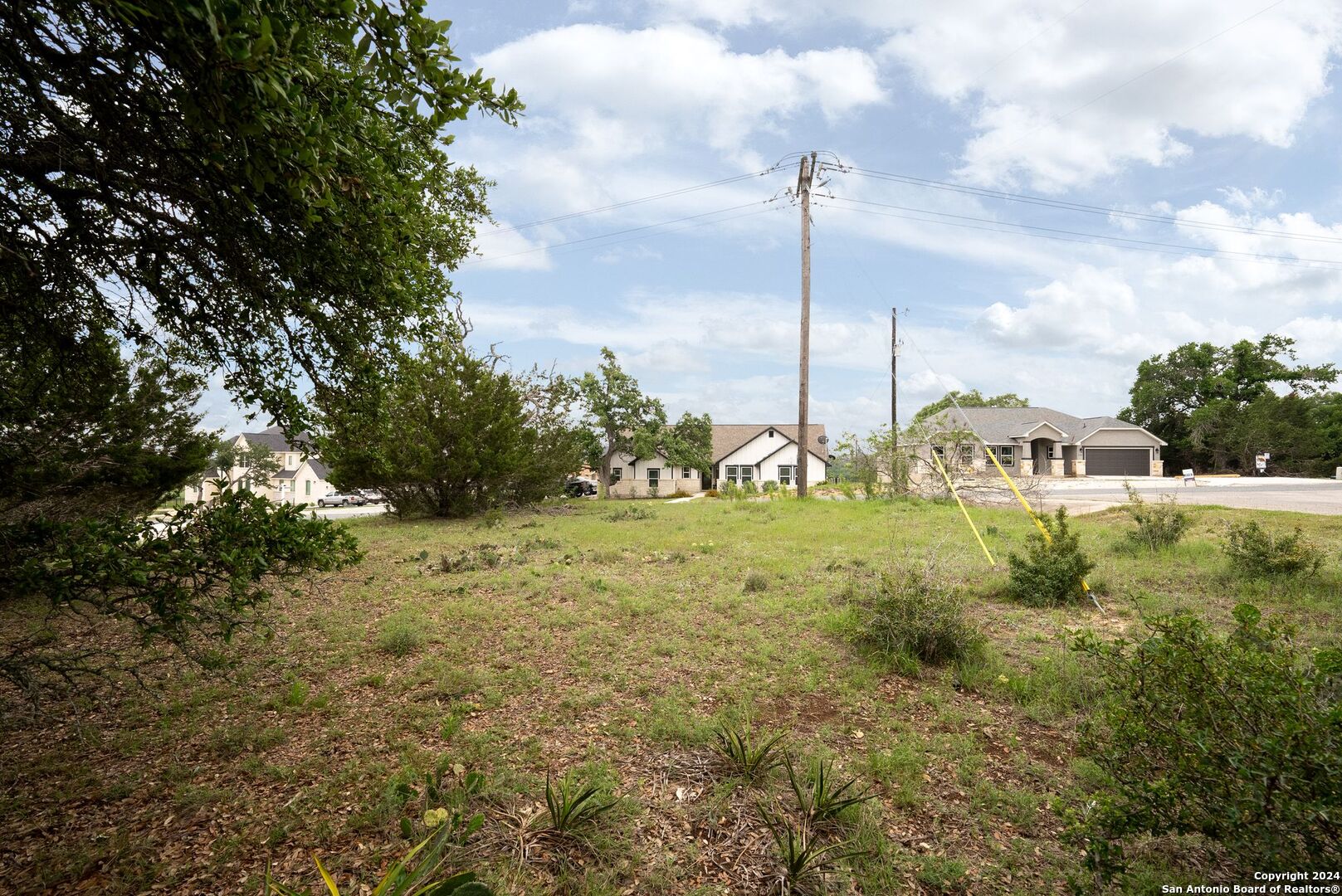 449 South Calvin Barrett Blanco, TX 78606 - Photo 23 of 23 a view of a garden with an buildings
