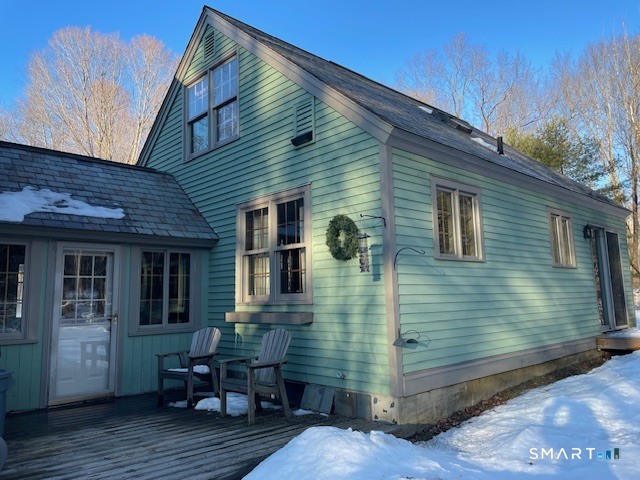 415 Kent Hollow Road Kent, CT 06785 - Photo 10 of 10 a view of wooden house with a chairs in patio