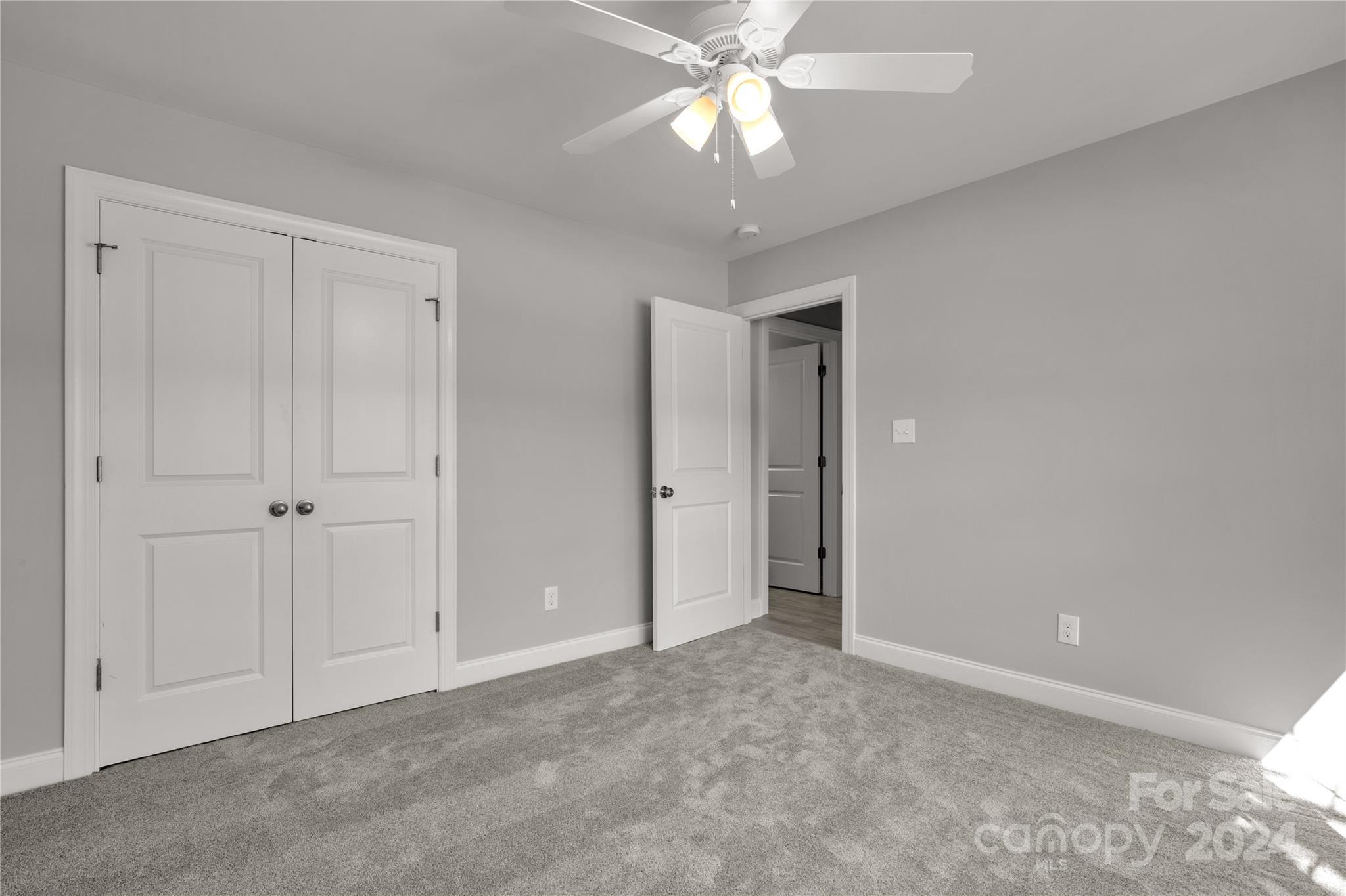 1780 Airport Road Lancaster, SC 29720 - Photo 22 of 26 a view of an empty room and chandelier fan