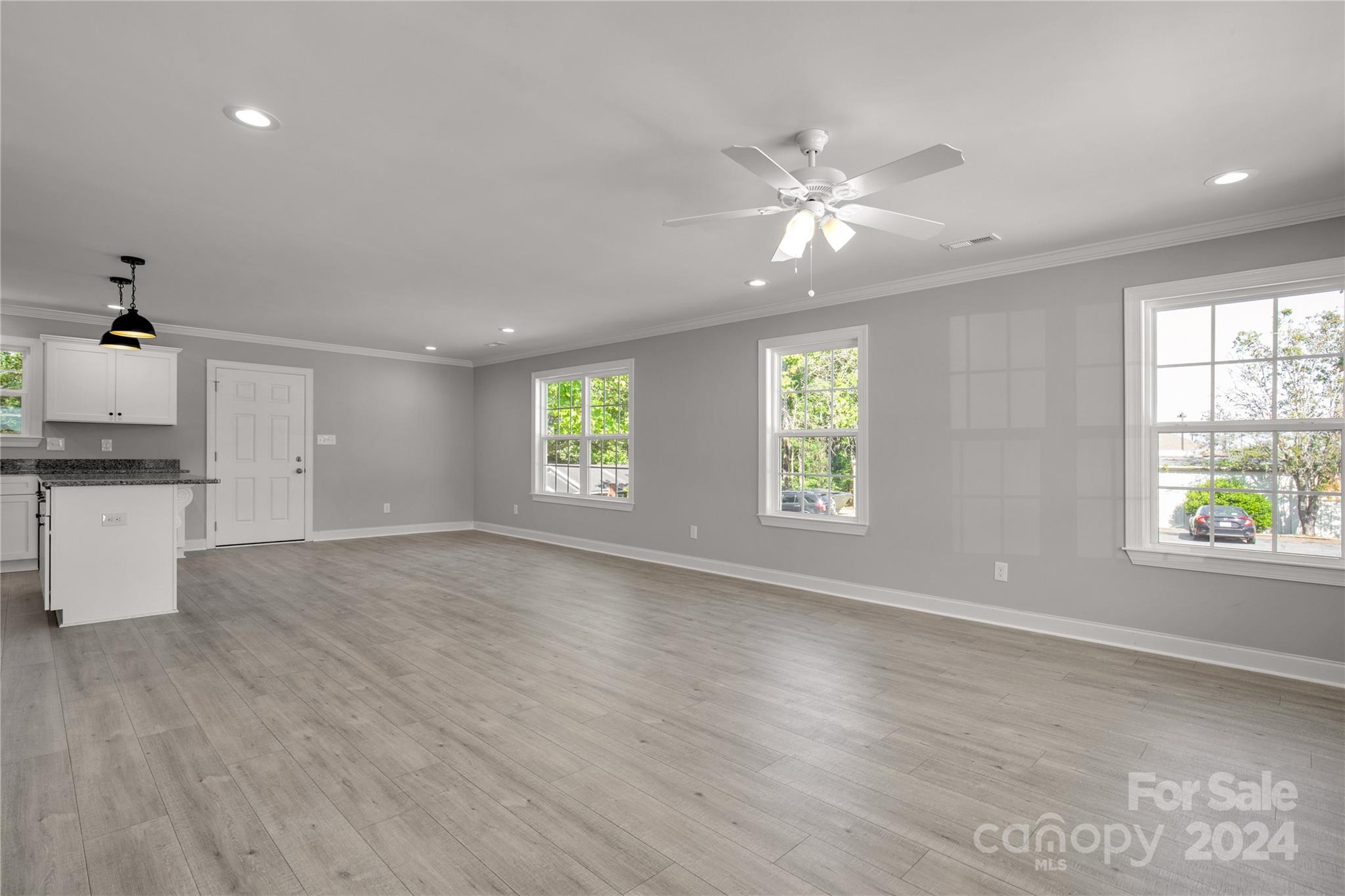1780 Airport Road Lancaster, SC 29720 - Photo 8 of 26 a view of an empty room with window and wooden floor