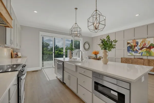 a kitchen with sink cabinets and window