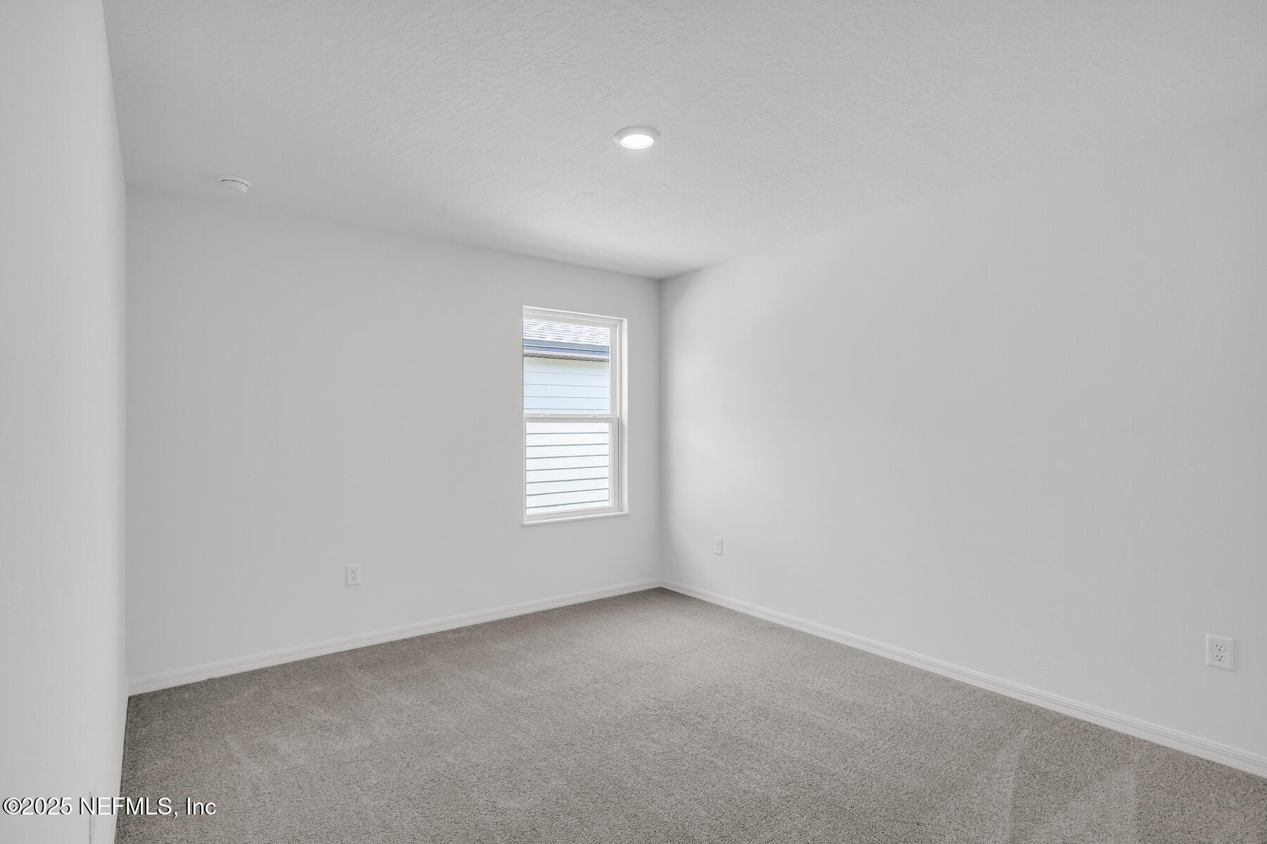 37282 Whisper Way Hilliard, FL 32046 - Photo 8 of 11 a view of an empty room with a window