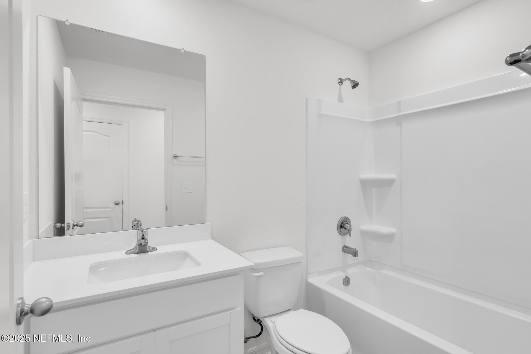 37282 Whisper Way Hilliard, FL 32046 - Photo 10 of 11 a bathroom with a sink toilet and bathtub