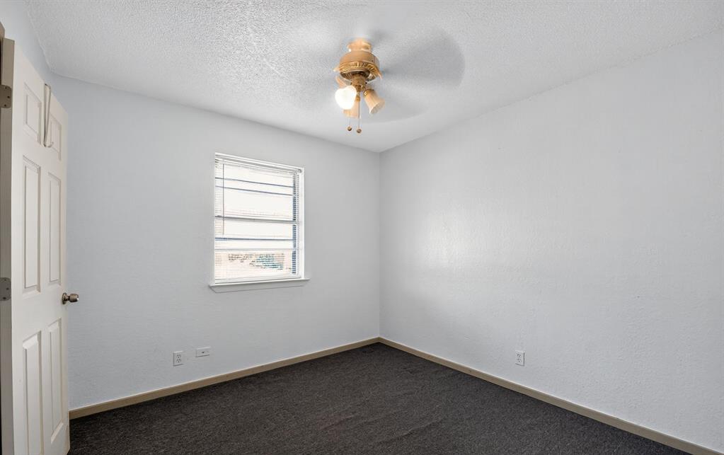 604 Fegan Street Weatherford, TX 76086 - Photo 18 of 36 an empty room with a window