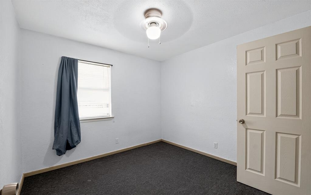 604 Fegan Street Weatherford, TX 76086 - Photo 19 of 36 an empty room with windows