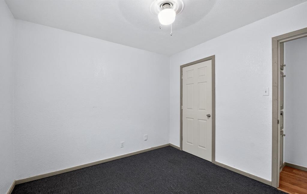 604 Fegan Street Weatherford, TX 76086 - Photo 24 of 36 an empty room with a chandelier fan