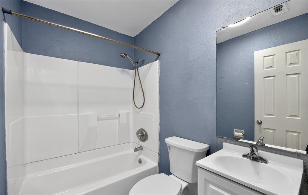 604 Fegan Street Weatherford, TX 76086 - Photo 26 of 36 a bathroom with a sink toilet and shower