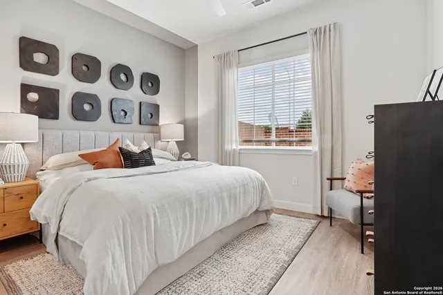 a bedroom with a bed and a window