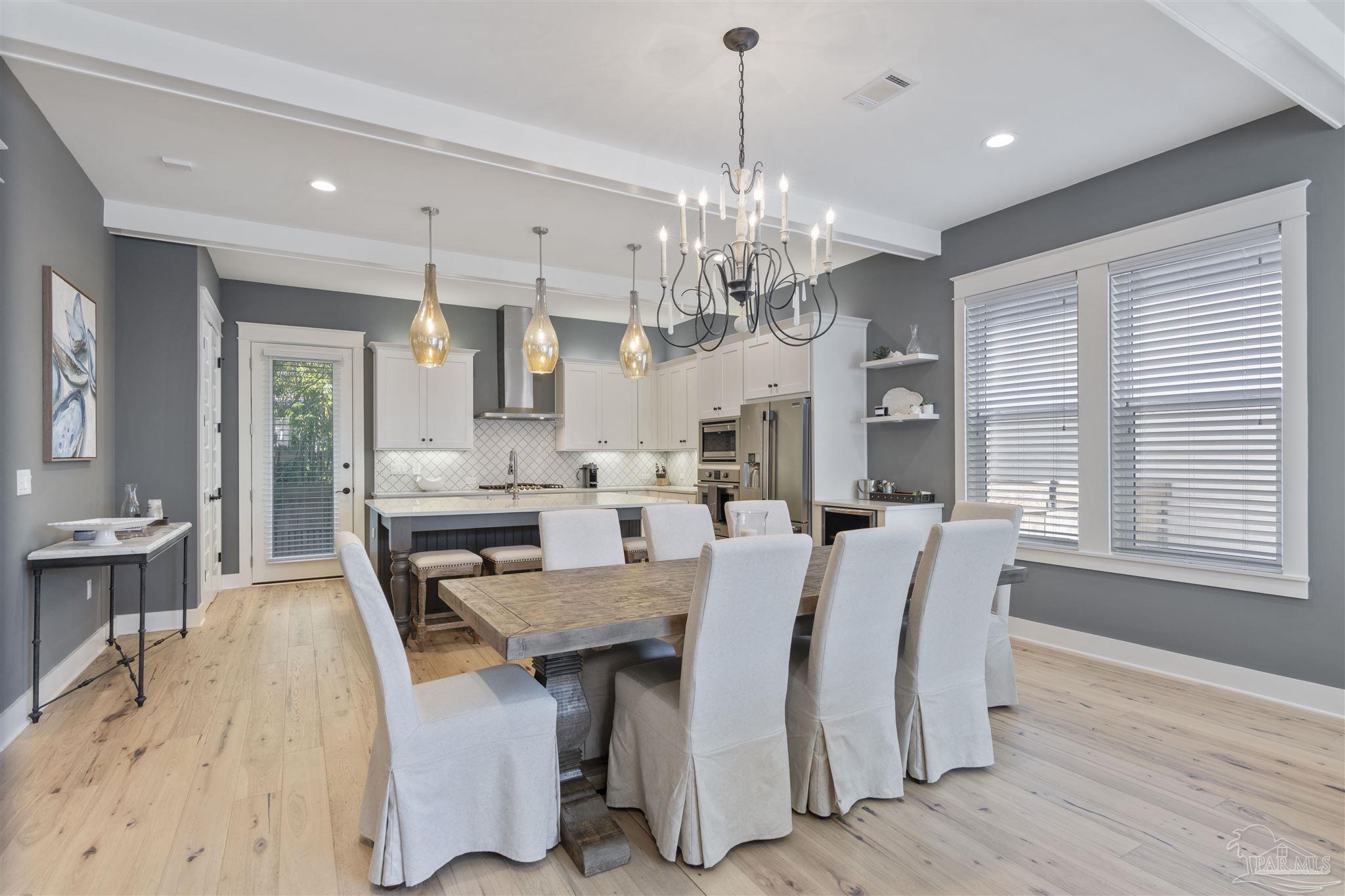 321 Ridgewalk Circle Santa Rosa Beach, FL 32459 - Photo 11 of 42 a view of a dining room with furniture window and wooden floor