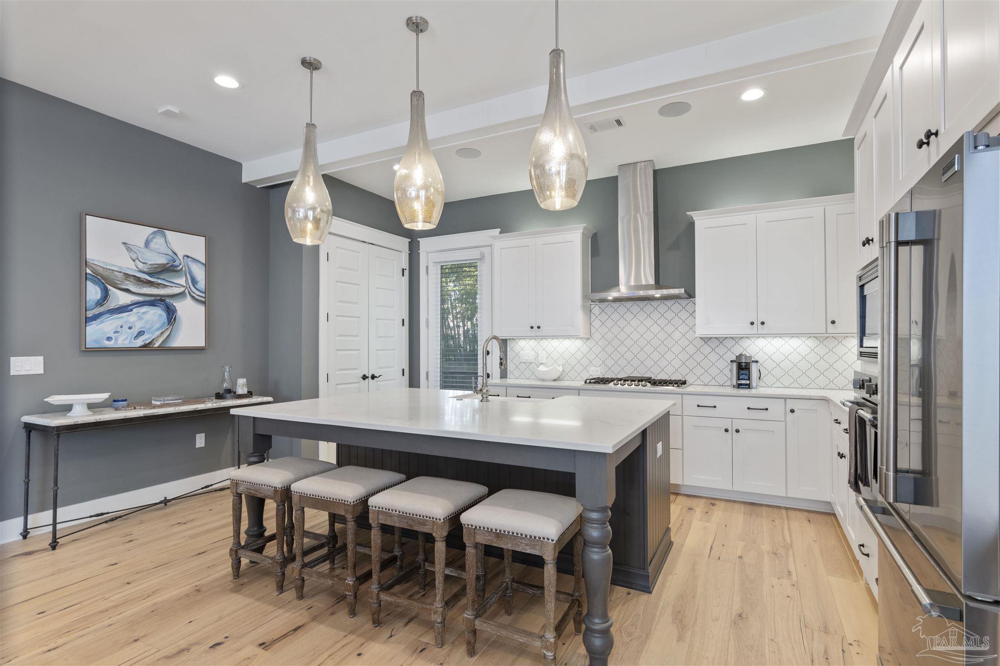 321 Ridgewalk Circle Santa Rosa Beach, FL 32459 - Photo 12 of 42 a large kitchen with a table and chairs in it