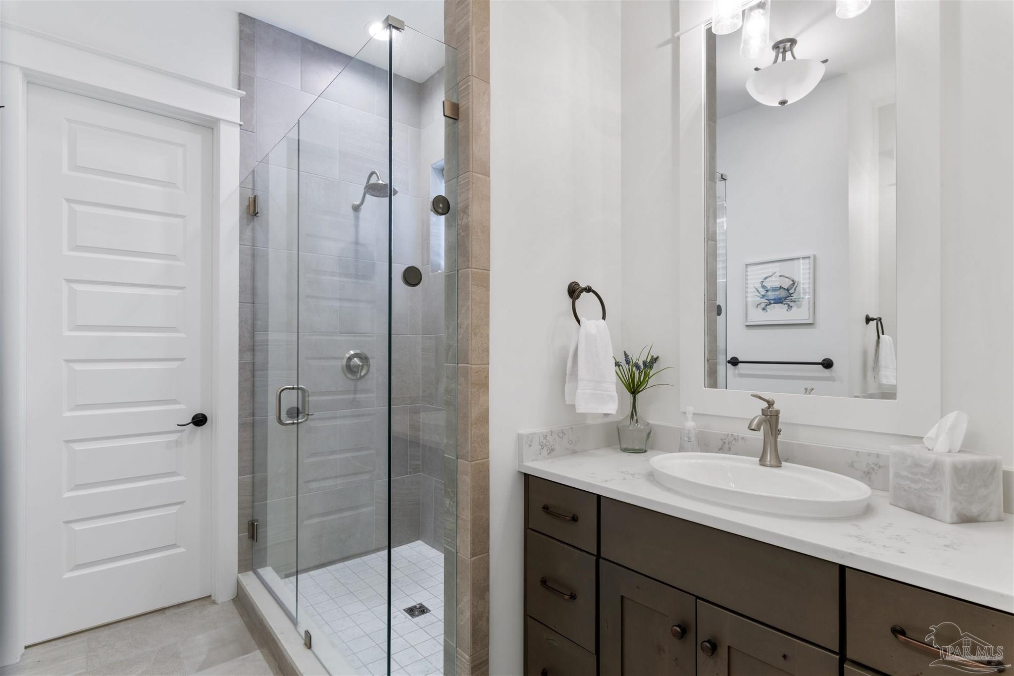 321 Ridgewalk Circle Santa Rosa Beach, FL 32459 - Photo 19 of 42 a bathroom with a shower sink and mirror