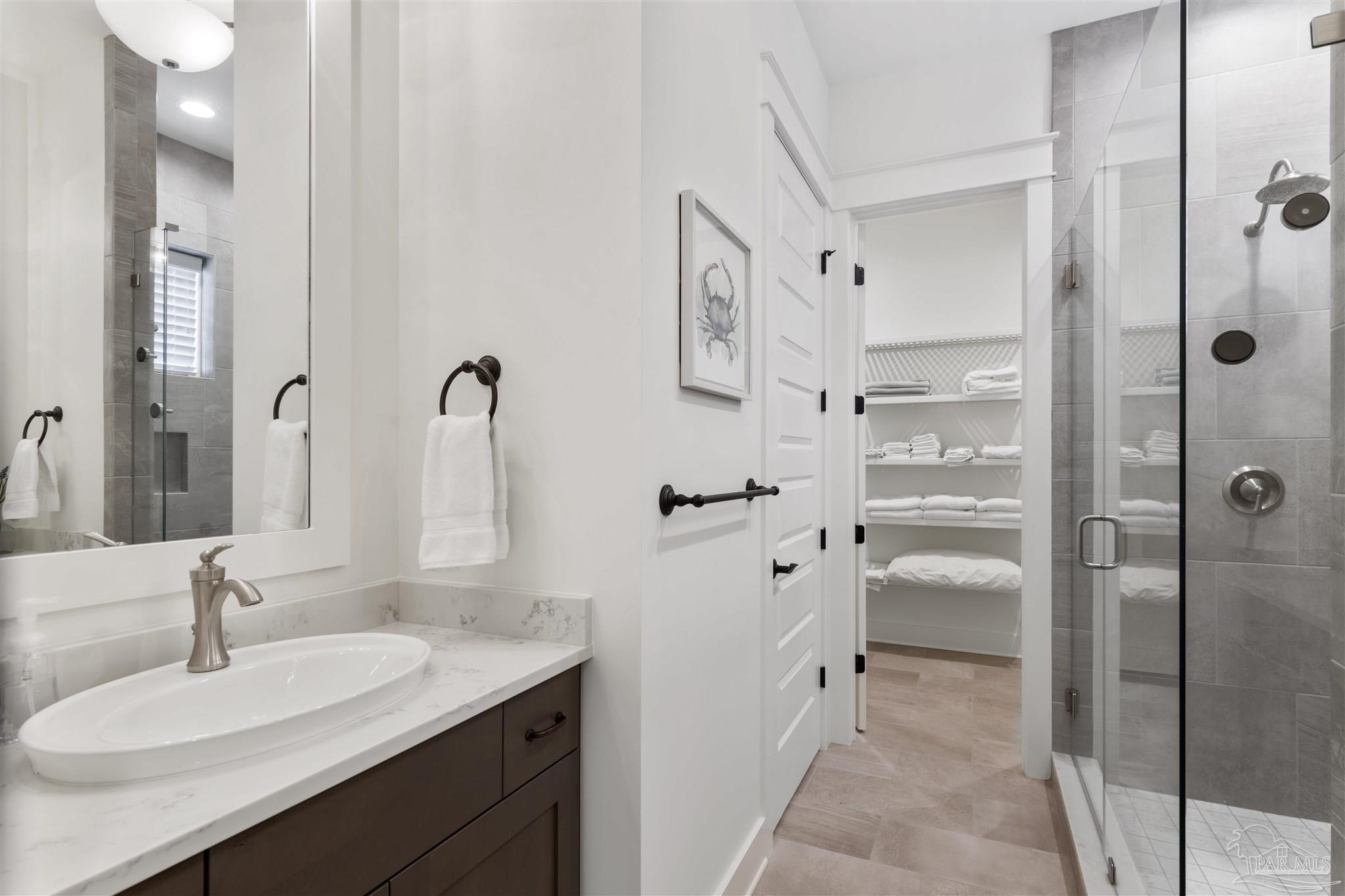 321 Ridgewalk Circle Santa Rosa Beach, FL 32459 - Photo 20 of 42 a bathroom with a granite countertop sink mirror and shower