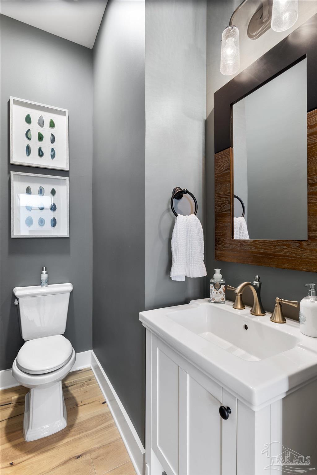 321 Ridgewalk Circle Santa Rosa Beach, FL 32459 - Photo 23 of 42 a bathroom with a toilet sink and mirror