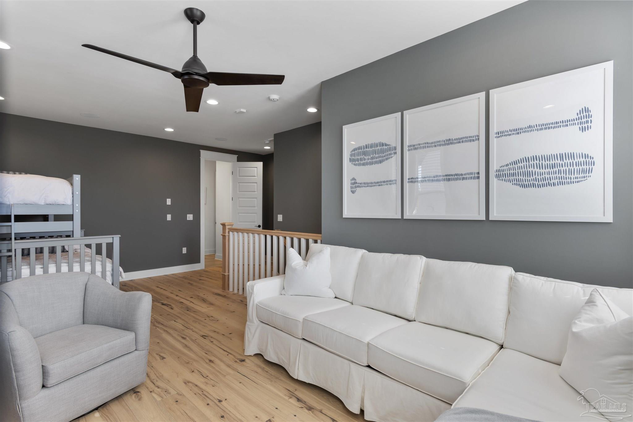 321 Ridgewalk Circle Santa Rosa Beach, FL 32459 - Photo 26 of 42 a living room with furniture and a large window