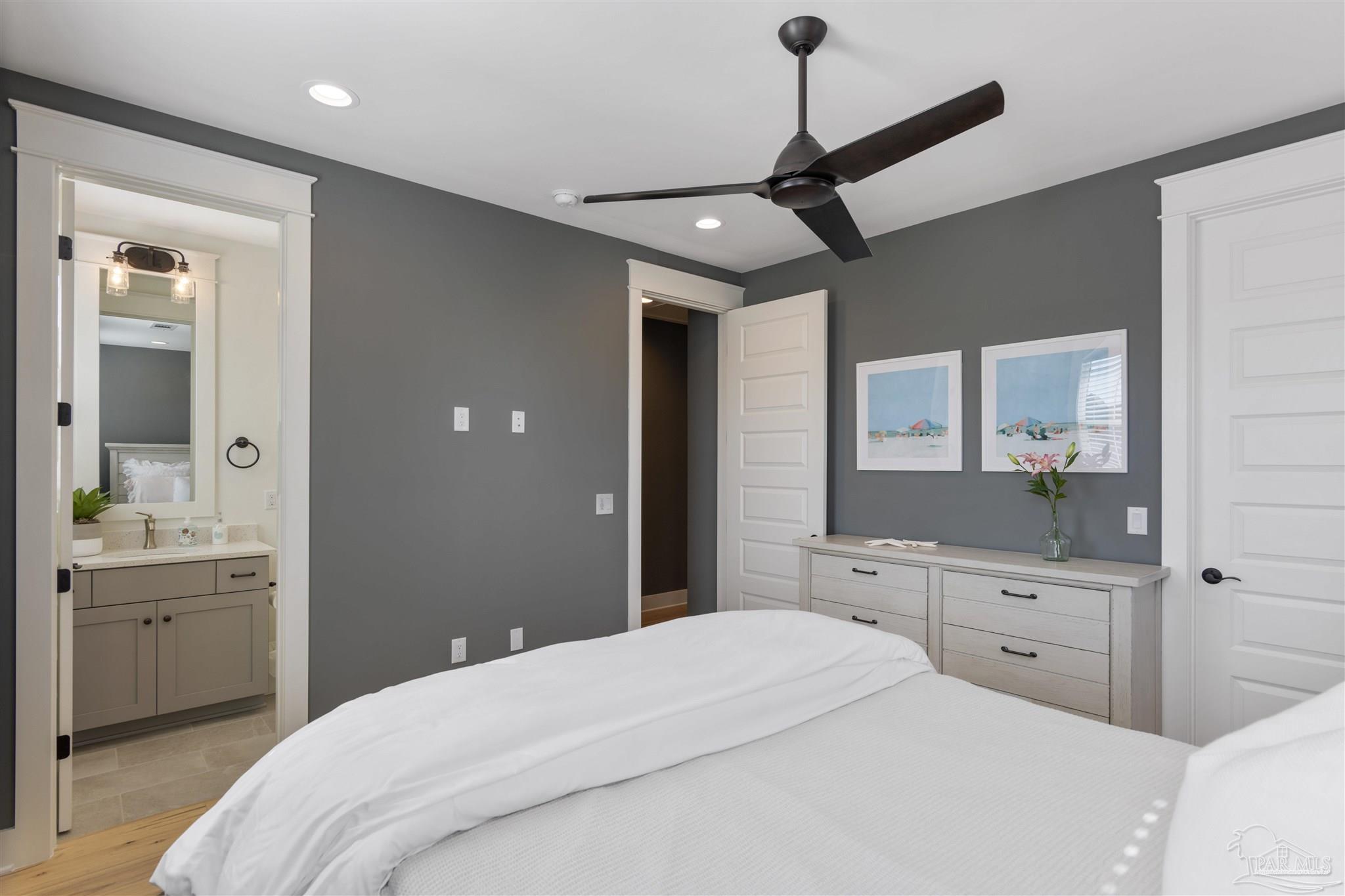 321 Ridgewalk Circle Santa Rosa Beach, FL 32459 - Photo 28 of 42 a bedroom with a bed and a mirror