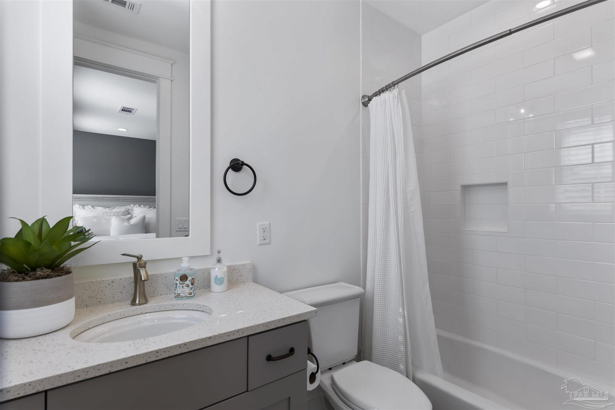 321 Ridgewalk Circle Santa Rosa Beach, FL 32459 - Photo 29 of 42 a bathroom with a granite countertop sink toilet a mirror and shower