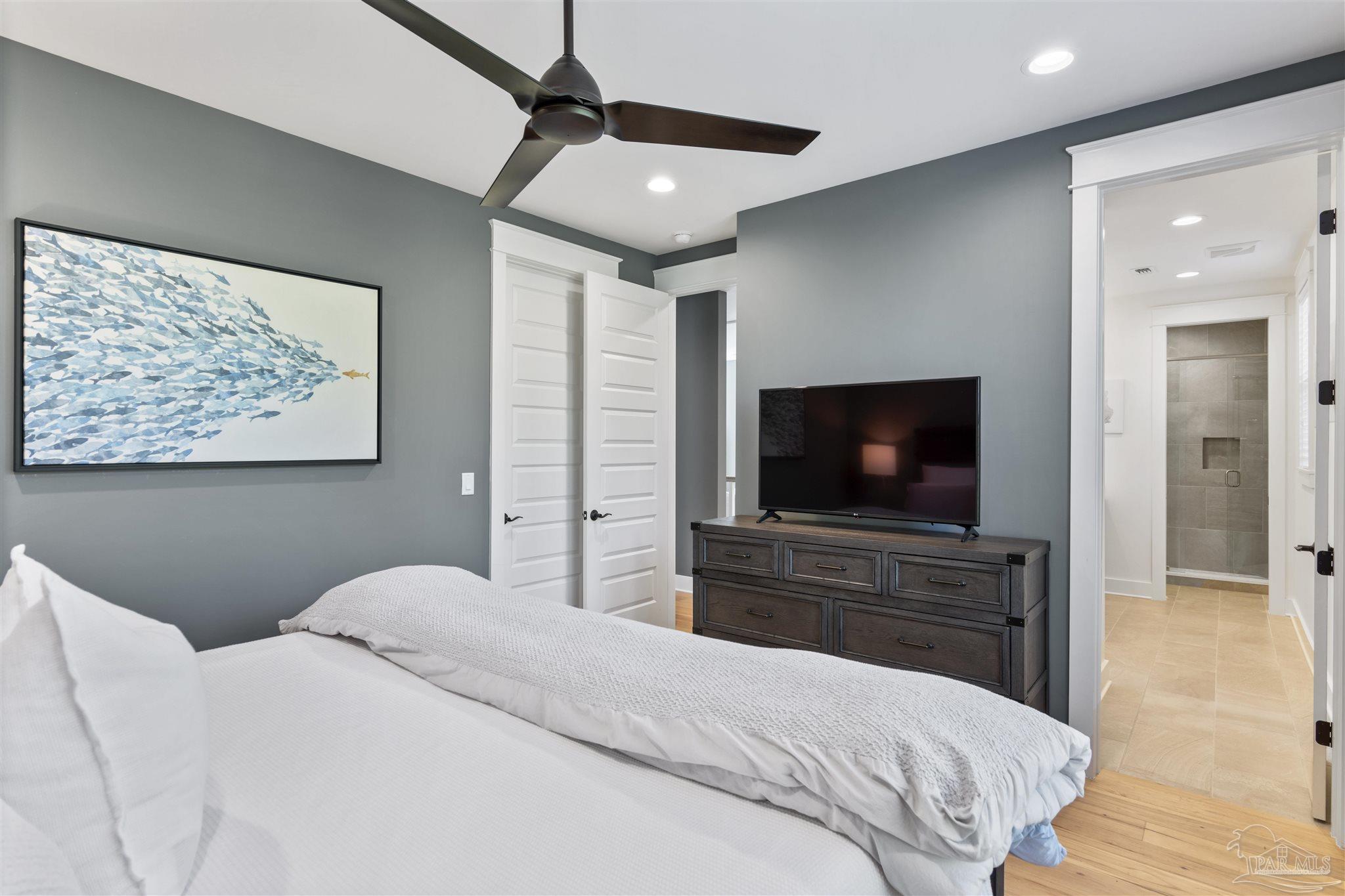 321 Ridgewalk Circle Santa Rosa Beach, FL 32459 - Photo 31 of 42 a bedroom with a bed and a flat screen tv