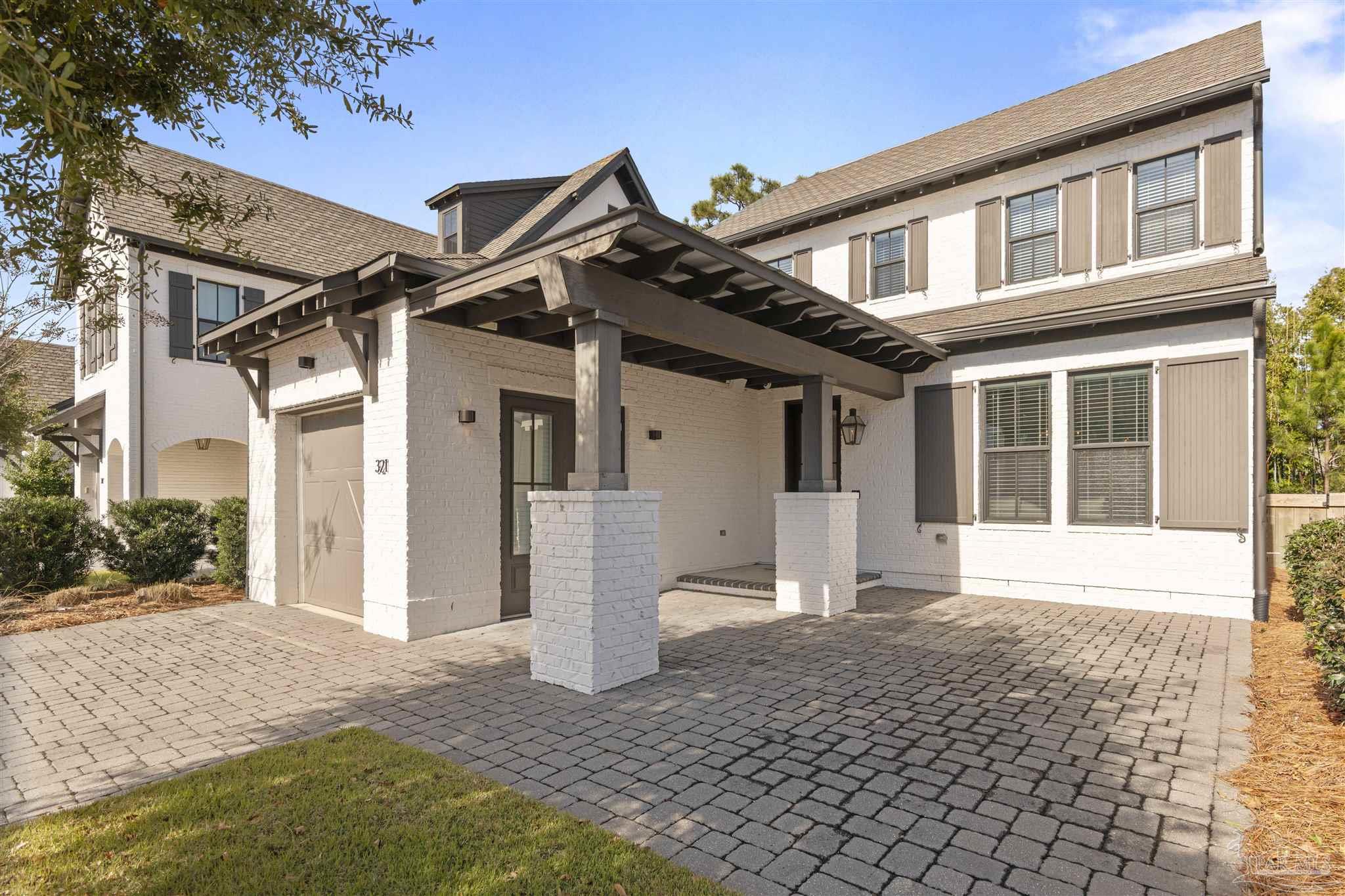 321 Ridgewalk Circle Santa Rosa Beach, FL 32459 - Photo 5 of 42 a front view of a house with a patio