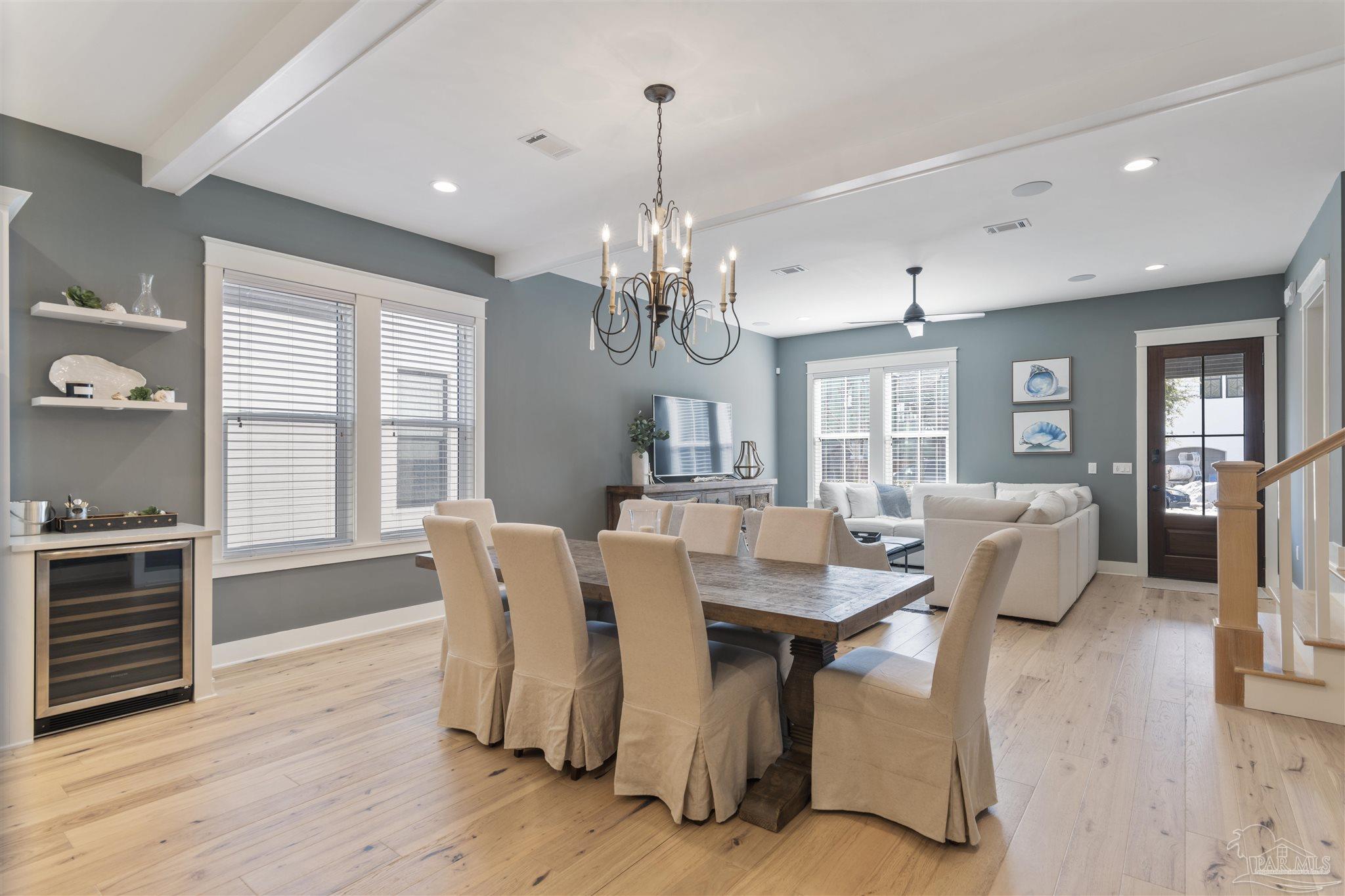321 Ridgewalk Circle Santa Rosa Beach, FL 32459 - Photo 10 of 42 a view of a dining room with furniture wooden floor and chandelier