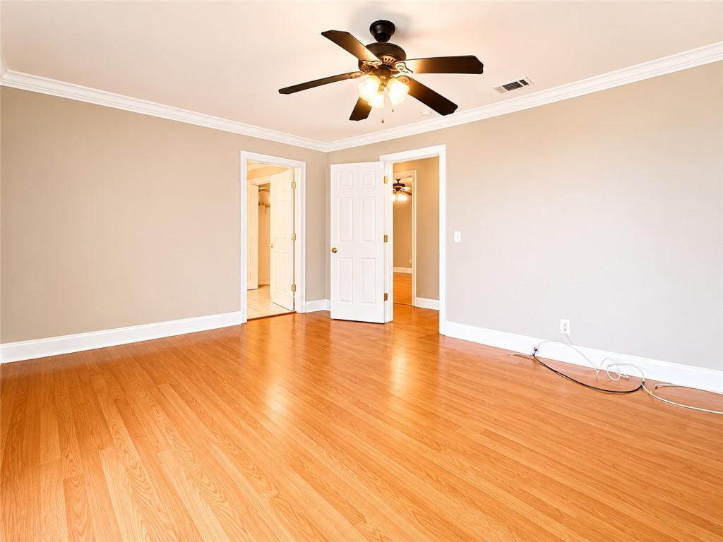 212 Craigtown Road Northeast Calhoun, GA 30701 - Photo 8 of 21 a view of an empty room with window and wooden floor