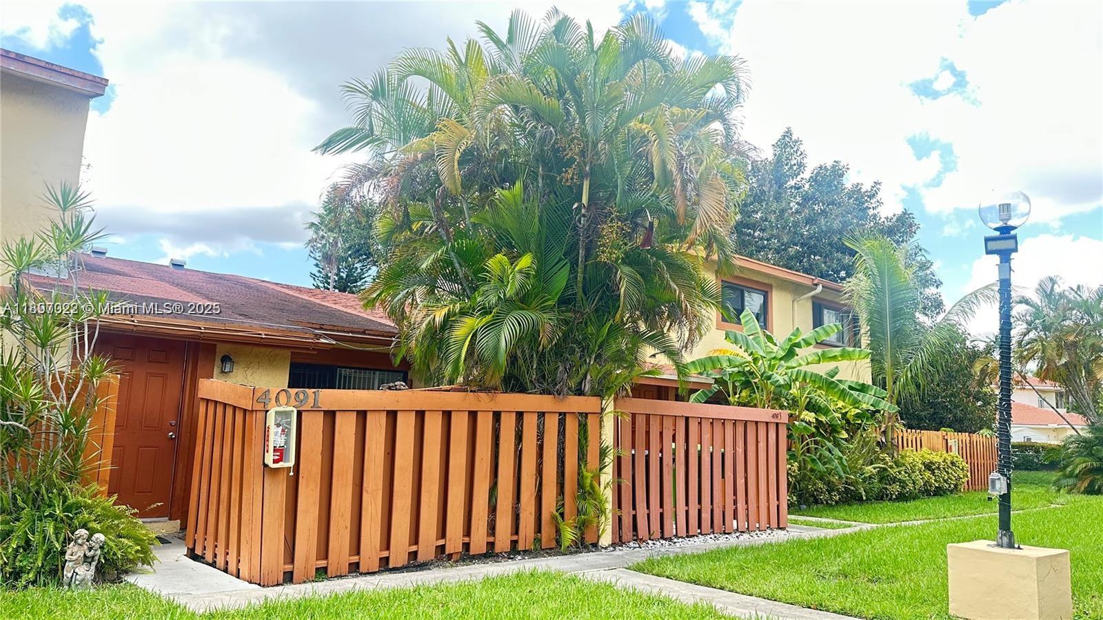 4091 Sierra Terrace, Unit 4091 Sunrise, FL 33351 - Photo 1 of 24 a backyard of a house with lots of green space
