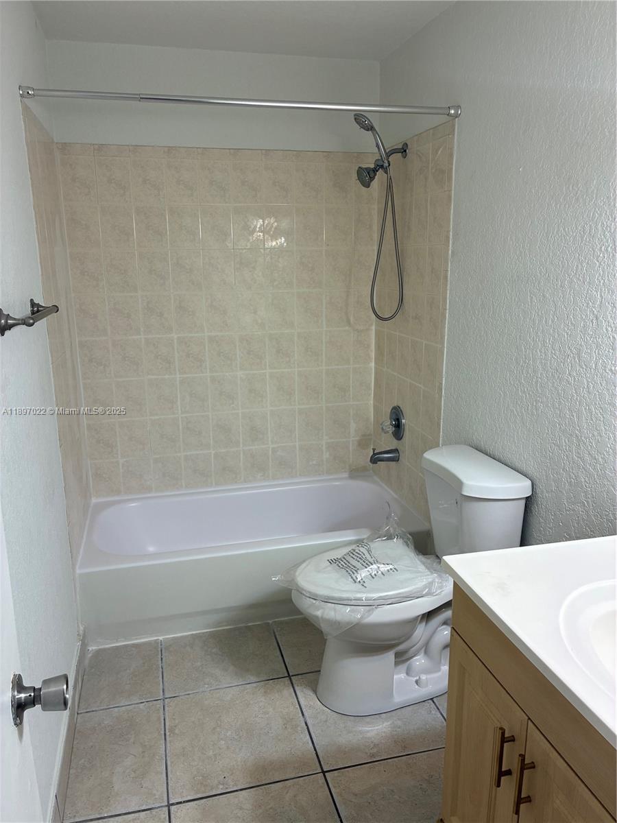 4091 Sierra Terrace, Unit 4091 Sunrise, FL 33351 - Photo 11 of 24 a bathroom with a sink toilet and shower