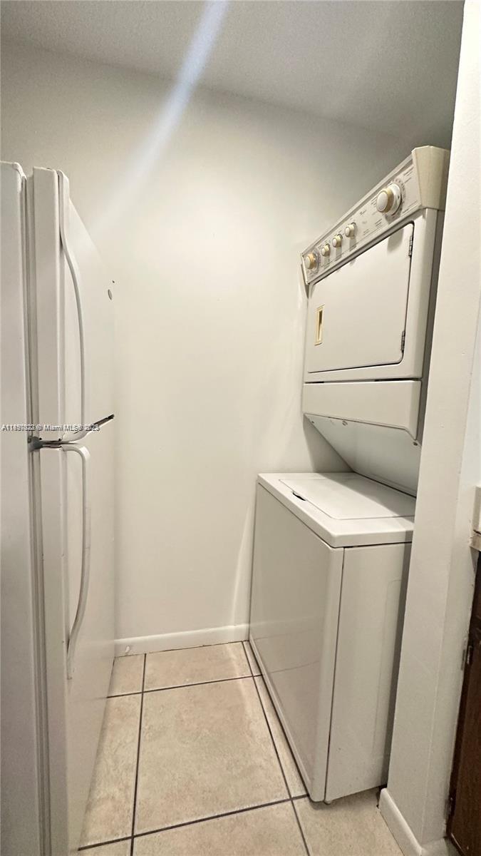 4091 Sierra Terrace, Unit 4091 Sunrise, FL 33351 - Photo 14 of 24 a utility room with dryer and washer