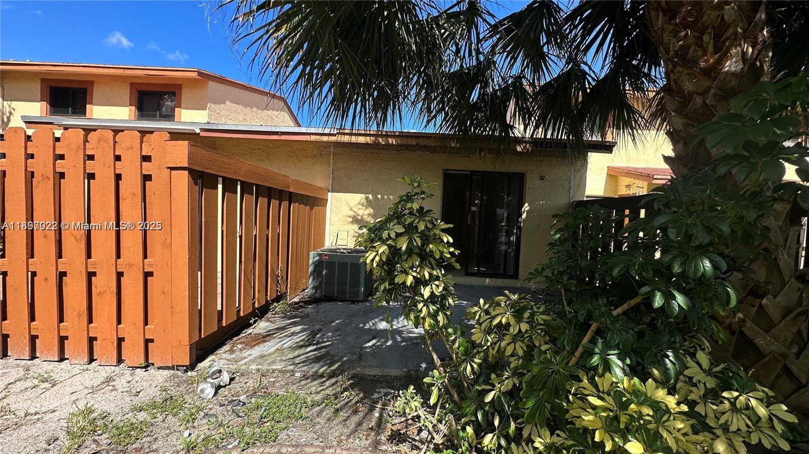 4091 Sierra Terrace, Unit 4091 Sunrise, FL 33351 - Photo 15 of 24 a view of a house with a small yard