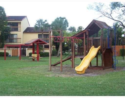 4091 Sierra Terrace, Unit 4091 Sunrise, FL 33351 - Photo 16 of 24 a view of a park with a slide