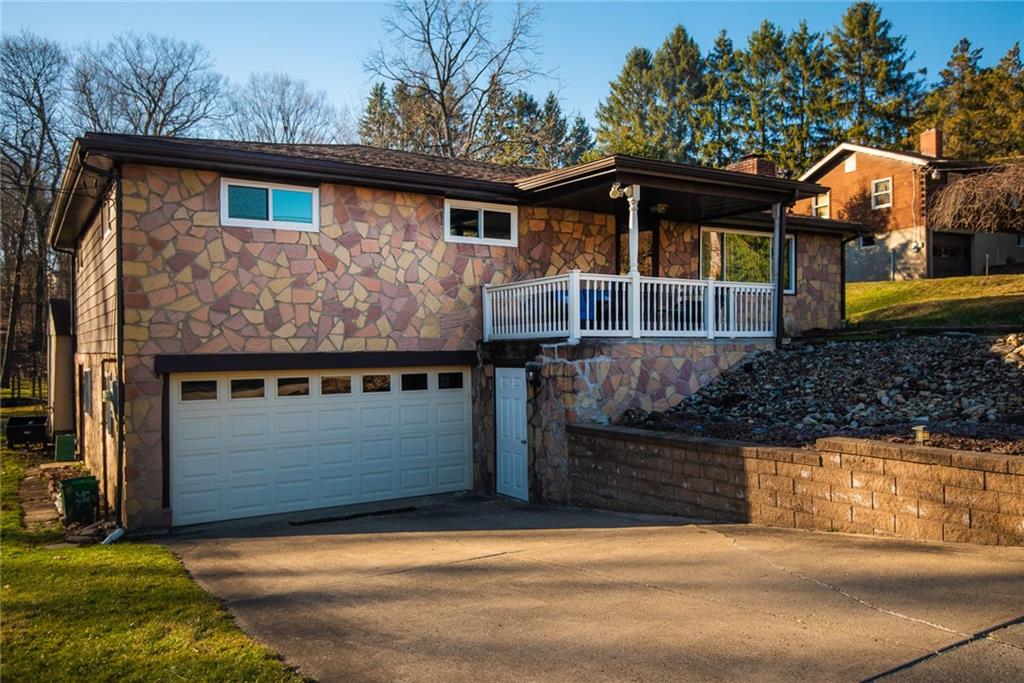 a front view of a house with garage