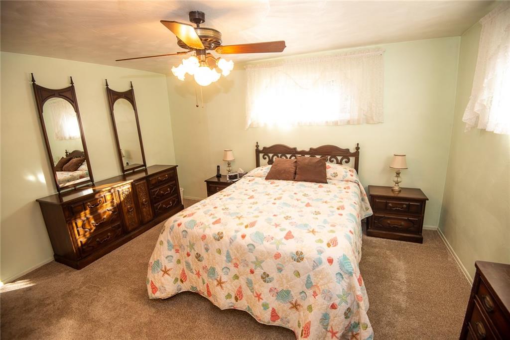 47 Grubbs Road Cheswick, PA 15024 - Photo 12 of 22 a bedroom with a bed and a chandelier