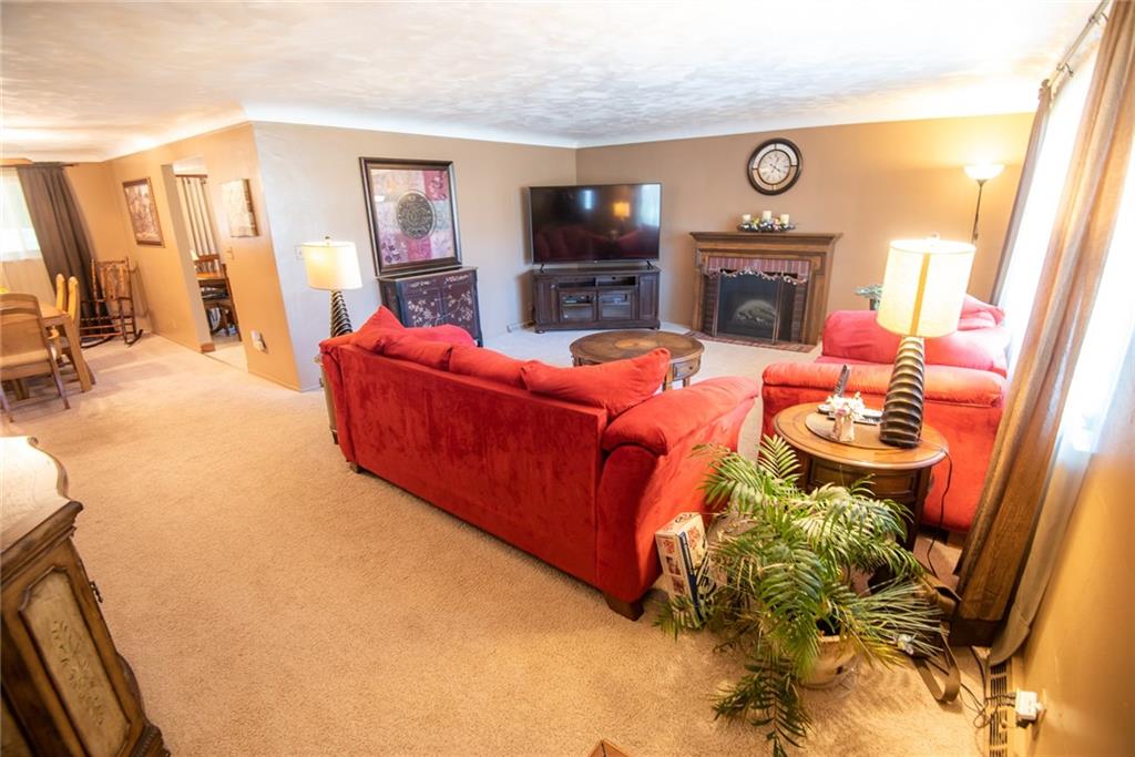 47 Grubbs Road Cheswick, PA 15024 - Photo 2 of 22 a living room with furniture and a fireplace