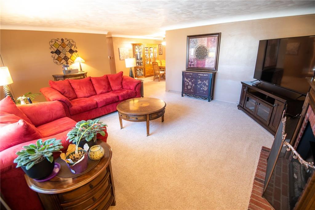 47 Grubbs Road Cheswick, PA 15024 - Photo 3 of 22 a living room with furniture and a flat screen tv