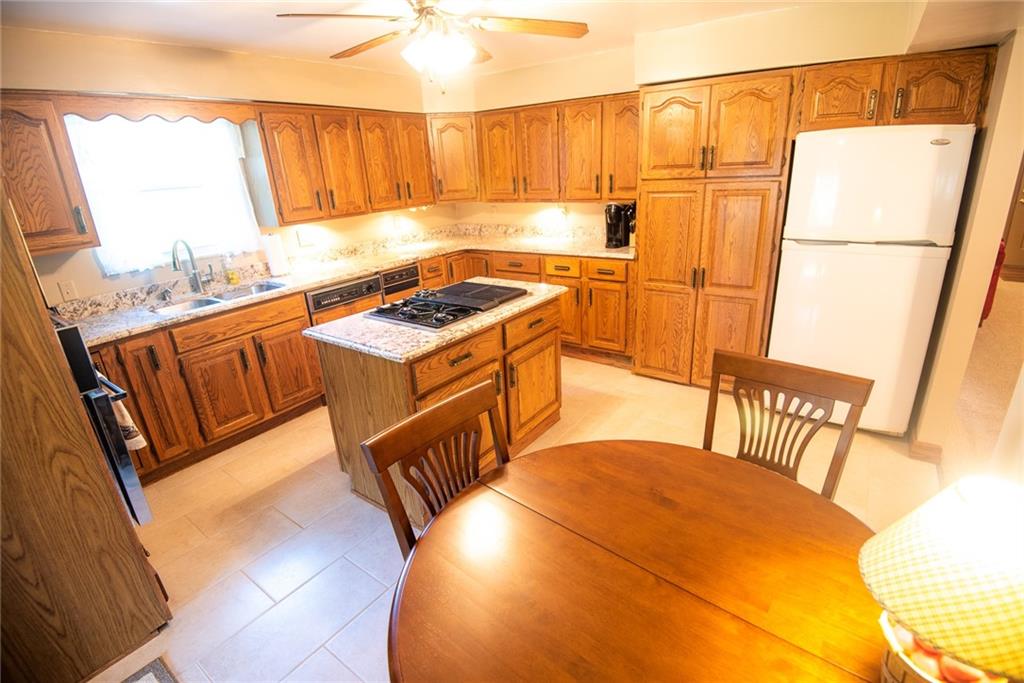 47 Grubbs Road Cheswick, PA 15024 - Photo 7 of 22 a kitchen with sink a refrigerator and a stove