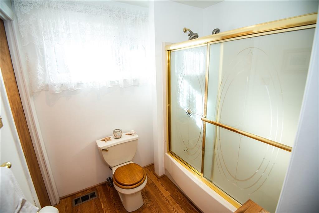 47 Grubbs Road Cheswick, PA 15024 - Photo 9 of 22 a bathroom with a toilet and a shower