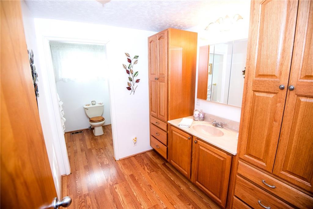 47 Grubbs Road Cheswick, PA 15024 - Photo 10 of 22 a bathroom with a sink and a mirror