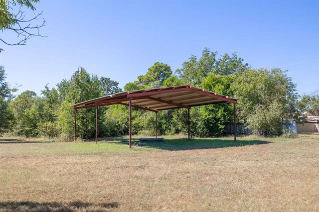 a backyard of a house with lots of green space