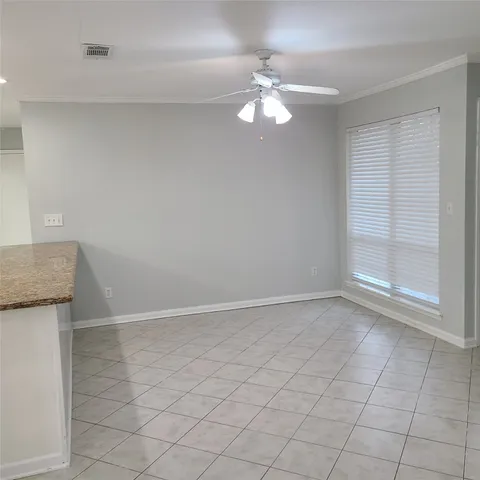 a bathroom with a granite countertop sink a mirror and a bathtub