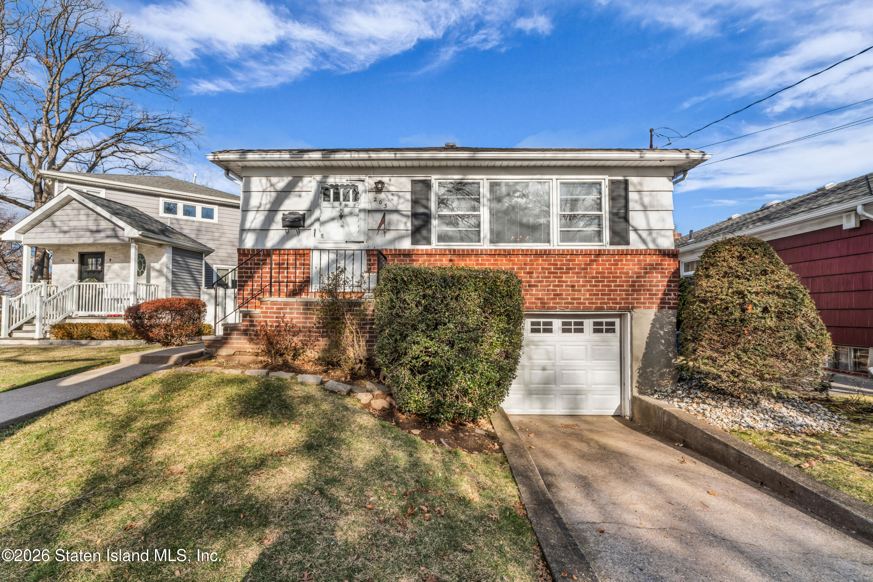 203 Wolverine Street Staten Island, NY 10306 - Photo 1 of 26 a view of a house with a patio