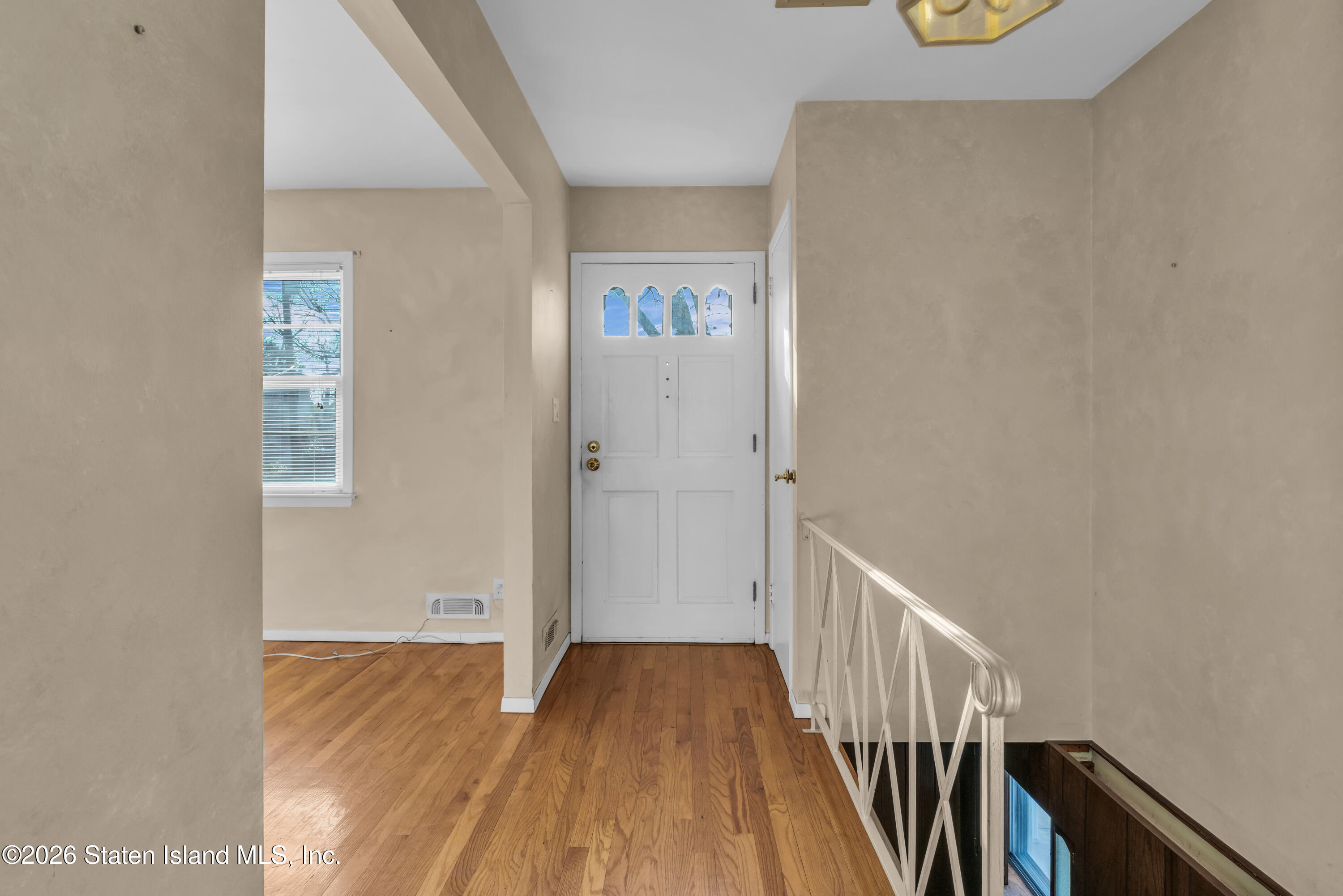 203 Wolverine Street Staten Island, NY 10306 - Photo 16 of 26 a view of a hallway with wooden floor