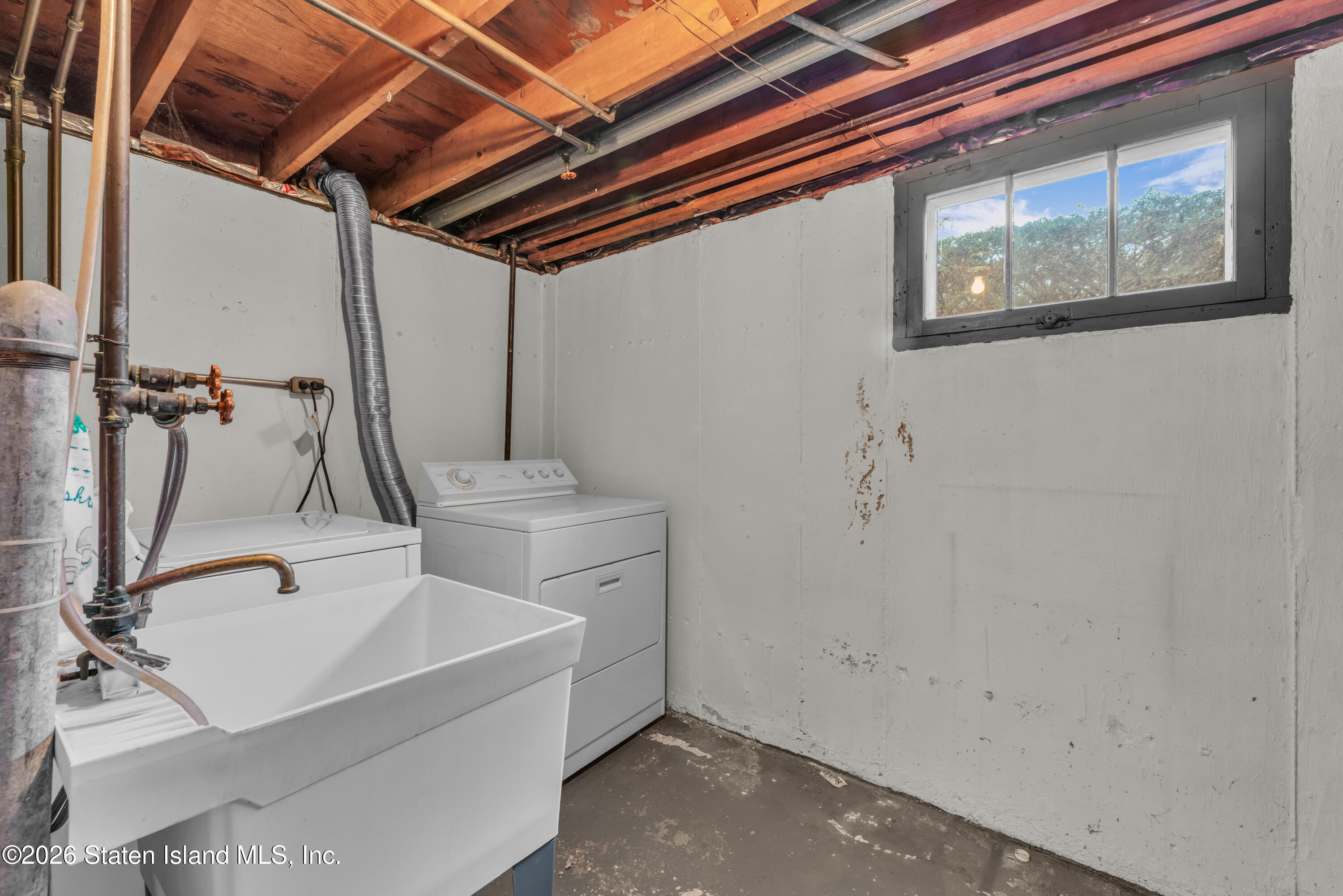 203 Wolverine Street Staten Island, NY 10306 - Photo 23 of 26 a bathroom with a sink and mirror